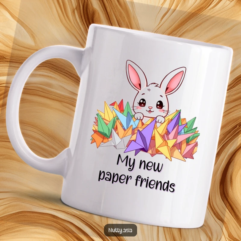 Funny mug featuring a cute bunny peeking curiously from a pile of colorful origami cranes, wide-eyed wonder.